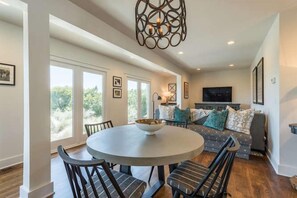 The lower level family room is surrounded by windows with beach views