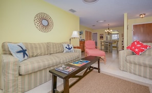 This condo in New Smyrna Beach Florida has a living room with two couches.