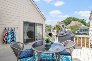 A large front porch is perfect for dining and grilling