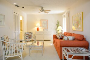 Den with couch and armchairs, can be closed off to make another bedroom.