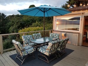 The dining area of the deck is right outside the kitchen/dining room