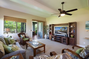 Living Room with Sofas, Accent Chairs, Ceiling Fan, and Smart TV