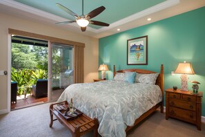 Bedroom with Access to the Private Lanai, Large Bed, and Ceiling Fan