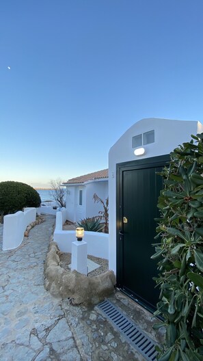 outside main entrance to property view at sunset 