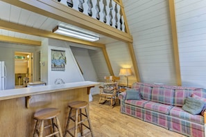 Watch the flat-screen TV while you recline on the cozy couch.
