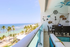 Beach and Pool View. Dinning room for 6 + Lounging furniture in the balcony for family and friends. 