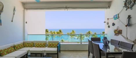 Beach and Pool View. Dinning room for 6 + Lounging furniture in the balcony for family and friends. 