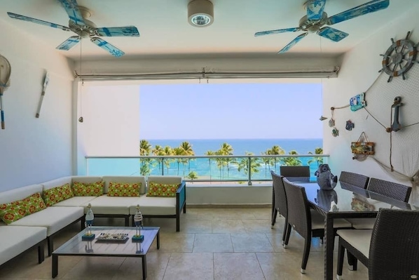 Beach and Pool View. Dinning room for 6 + Lounging furniture in the balcony for family and friends. 