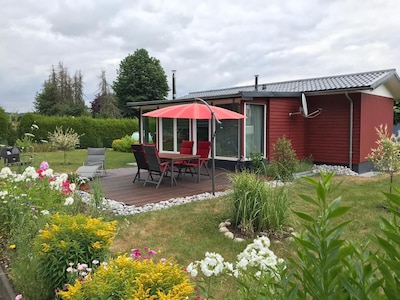 Wooden house with large garden and sauna "dogs welcome" 