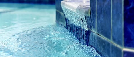 Waterfall between pool and spa