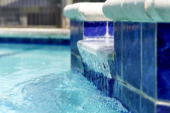 Waterfall between pool and spa