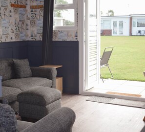 Patio doors open onto the commnal lawn