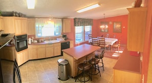 Large eat-in kitchen with breakfast bar and dining room