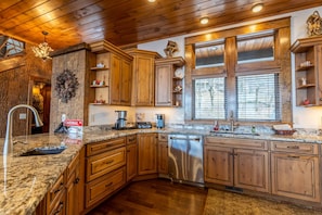 Kitchen with Granite Counters and Custom Cabinetry