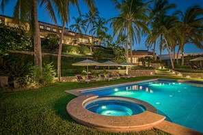 Lounge under the tall palm trees and feel as if you're in a secluded hideaway everywhere in this villa.