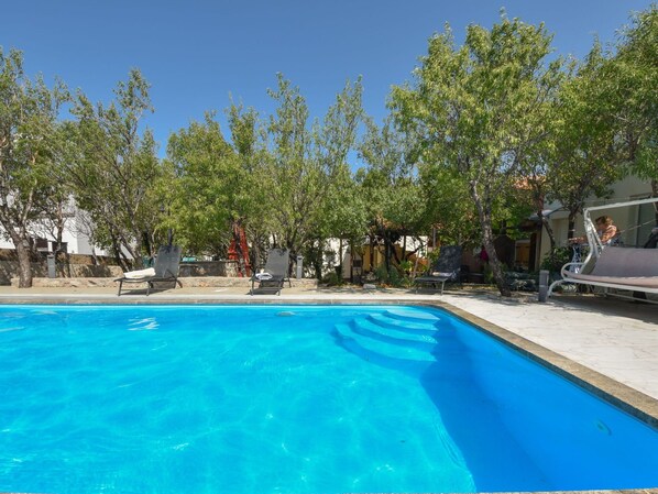 Water, Plant, Swimming Pool, Tree, Shade, Outdoor Furniture, Leisure, Rectangle, Composite Material, Landscape