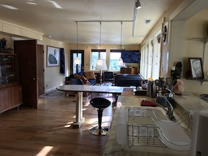 View from kitchen through   living room, open concept