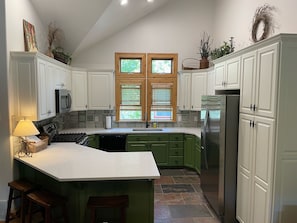 Kitchen got a refresh in fall 2021. New counters, back splash & cabinet paint.