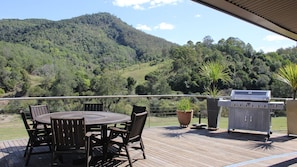 Outdoor fixed deck with BBQ overlooking the river