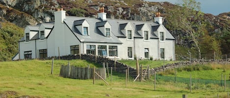 The view of the house from the stone bridge in Clashnessie.