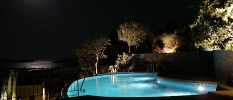 Pool and full moon over Aegean Sea