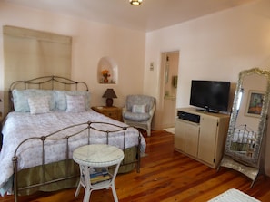 The queen bed looking towards the bathroom