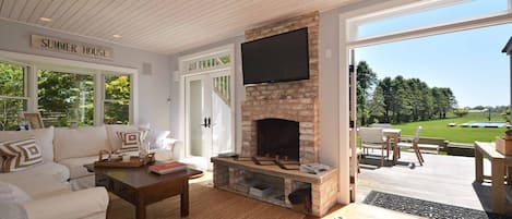 Living Room with Deck. Indoor/Outdoor Fireplace and Sonos music system.