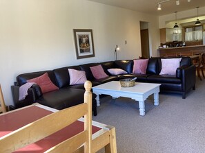 Large sectional with Chaise and card table.