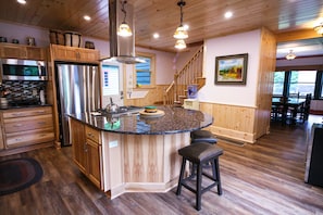 Island seating for six in open concept kitchen