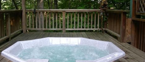 Picture yourself in the hot tub under the canopy of trees