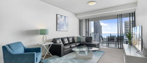 Modern living room with flat screen TV and amazing views from level 27