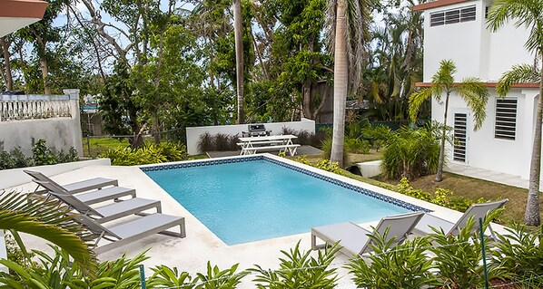 Pool with plenty of chaise lounge chairs