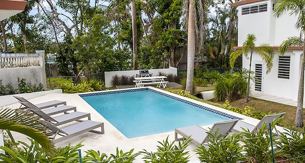 Pool with plenty of chaise lounge chairs