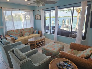 Many windows to enjoy views in the living room.  Cable, Smart TV, high speed int
