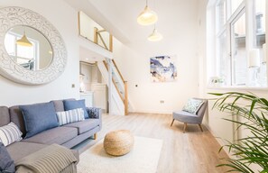Open plan lounge/kitchen with mezzanine level