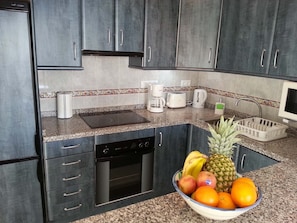 Kitchen with dishwasher, microwave, ceramic hob, oven, coffee machine, toaster, 