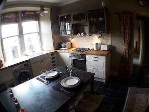 fully equipped kitchen with dining space