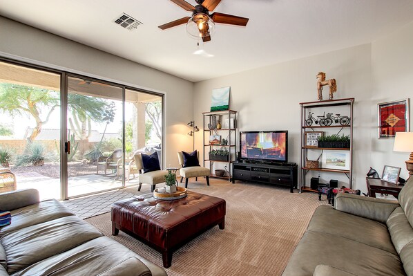 Living room with large arcadia door to the backyard.  