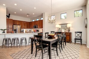 Formal dining and bar stools for casual breakfast or lunch.