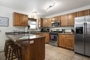 Fully equipped kitchen with new appliances. Everything you need for group meals during your stay!
