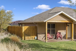 Private home on quiet street with beautiful front yard and fully fenced back yard.