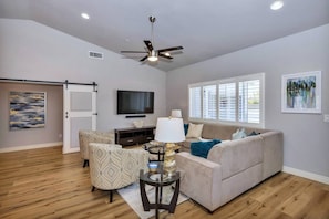 Our living room is cozy, yet has enough space to bring over chairs and snacks to watch the big game.