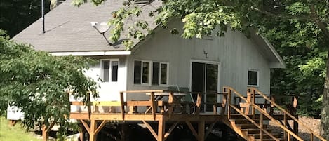 Cabin with full deck facing the lake