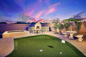 Fun putting green and outdoor fireplace!