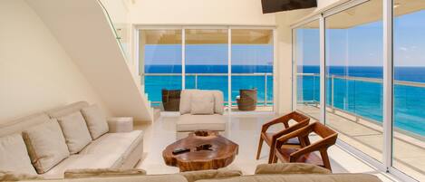 Panoramic Ocean View From the Living Room Through Telescoping Sliding Doors