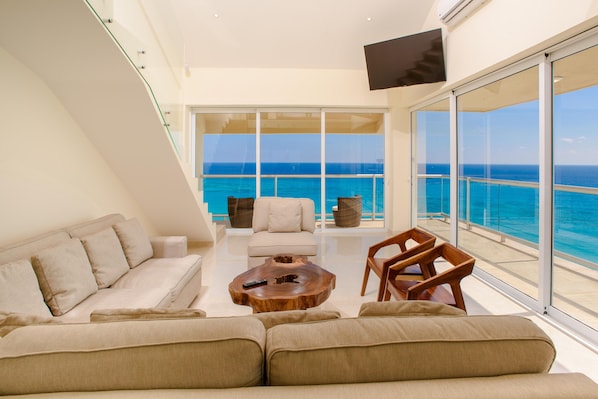 Panoramic Ocean View From the Living Room Through Telescoping Sliding Doors