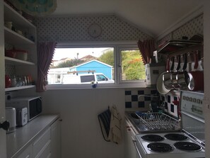 Kitchen including electric oven incl hob & grill, microwave, toaster, kettle etc