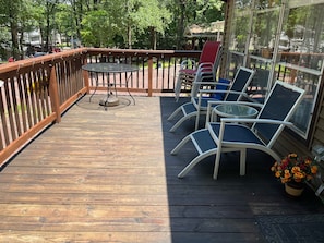 Front deck has 4 chairs to go around the table plus 2 comfy chairs to view lake