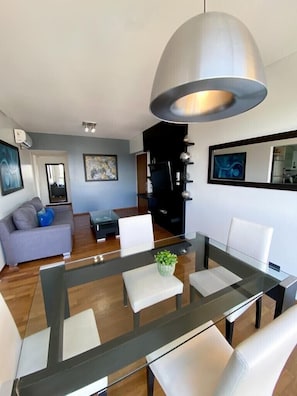 Here’s our living and dining area featuring all original art an natural lighting
