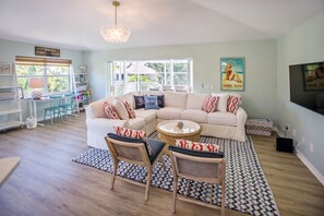 Relax and unwind in this gorgeous open concept living room with beautiful custom furniture